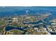 Aerial view showcases neighborhood canals, lush landscaping, and waterfront location with ocean access at 714 Bayshore Dr, Tarpon Springs, FL 34689