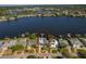 This waterfront property features a private boat dock, a pool, and tropical landscaping at 714 Bayshore Dr, Tarpon Springs, FL 34689