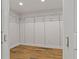 Spacious walk-in closet with wood flooring and ample shelving at 714 Bayshore Dr, Tarpon Springs, FL 34689