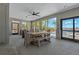 Relaxing outdoor dining area with a large table, comfortable seating, and views of the pool and waterfront at 714 Bayshore Dr, Tarpon Springs, FL 34689
