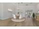 Dining room with seating for six, decorated with modern paintings at 714 Bayshore Dr, Tarpon Springs, FL 34689