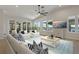 Comfortable living room featuring stylish decor, large windows overlooking the waterfront, and plenty of seating at 714 Bayshore Dr, Tarpon Springs, FL 34689