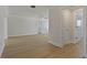 Bright, spacious living room with light-colored floors and multiple entryways at 714 Bayshore Dr, Tarpon Springs, FL 34689