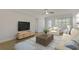 Comfortable living room with a large television, modern furniture, and an area rug at 714 Bayshore Dr, Tarpon Springs, FL 34689