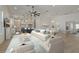 Open concept living room, dining area, and kitchen with coastal decor and lots of seating at 714 Bayshore Dr, Tarpon Springs, FL 34689