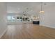 Bright, open-concept living area with wood floors, water views, and seamlessly connected kitchen at 714 Bayshore Dr, Tarpon Springs, FL 34689