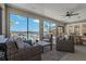Comfortable patio with wicker furniture overlooking a scenic waterfront and pool at 714 Bayshore Dr, Tarpon Springs, FL 34689