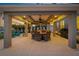 Inviting outdoor patio featuring a covered dining area perfect for entertaining guests in a private setting at 714 Bayshore Dr, Tarpon Springs, FL 34689