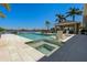 Outdoor pool and spa with surrounding pool chairs, gazebo, and waterfront view at 714 Bayshore Dr, Tarpon Springs, FL 34689
