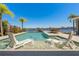 Inviting waterfront pool with sun loungers, serene views, and lush landscaping, perfect for relaxation and entertaining at 714 Bayshore Dr, Tarpon Springs, FL 34689