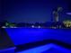 Night view of the pool and backyard featuring underwater lighting at 714 Bayshore Dr, Tarpon Springs, FL 34689