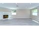 Spacious living room featuring a decorative white brick fireplace and recessed lighting at 804 Shore W Dr, Oldsmar, FL 34677