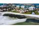 Beautiful aerial view of the property with pristine beach, multiple buildings and coastal access at 895 S Gulfview Blvd # 309, Clearwater Beach, FL 33767