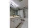Bright bathroom with a tub-shower, modern vanity, and white tile flooring at 895 S Gulfview Blvd # 309, Clearwater Beach, FL 33767