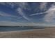 Beautiful beach view with clear water and bright, sunny skies for this real estate listing at 895 S Gulfview Blvd # 309, Clearwater Beach, FL 33767