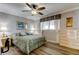 Cozy bedroom with a ceiling fan, bedside lamps, and wood-look floors creates a relaxing atmosphere at 895 S Gulfview Blvd # 309, Clearwater Beach, FL 33767