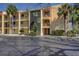 Exterior of a multi-story condo building featuring private balconies, well-maintained landscaping and convenient parking at 895 S Gulfview Blvd # 309, Clearwater Beach, FL 33767