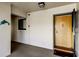 Condo entrance with a decorative dolphin, and the unit door with secure access features at 895 S Gulfview Blvd # 309, Clearwater Beach, FL 33767