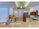 Bright kitchen with stainless steel refrigerator, electric range, and breakfast bar seating at 895 S Gulfview Blvd # 309, Clearwater Beach, FL 33767