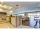 Bright, open kitchen flows into the living area with views, features updated appliances and classic white cabinetry at 895 S Gulfview Blvd # 309, Clearwater Beach, FL 33767