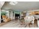 Bright living room featuring hardwood floors, mirrored walls, and comfortable couches at 895 S Gulfview Blvd # 309, Clearwater Beach, FL 33767
