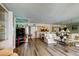 Bright living room featuring hardwood floors, mirrored walls, and comfortable couches at 895 S Gulfview Blvd # 309, Clearwater Beach, FL 33767