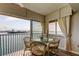 Condo dining area with seating and a beautiful waterfront view at 895 S Gulfview Blvd # 309, Clearwater Beach, FL 33767