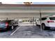 Covered parking area with ample space for multiple vehicles and well-maintained surroundings at 895 S Gulfview Blvd # 309, Clearwater Beach, FL 33767