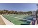 Community shuffleboard courts with benches, surrounded by lush landscaping and building in the background at 895 S Gulfview Blvd # 309, Clearwater Beach, FL 33767