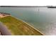 Expansive waterfront view featuring a manicured lawn and serene bay waters at 895 S Gulfview Blvd # 309, Clearwater Beach, FL 33767