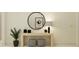 Elegant entryway featuring a round mirror, stylish console table, and chic decor at 9340 Gladsome Dr, Land O Lakes, FL 34637