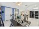 Cozy dining room with modern finishes, stylish decor, and tiled floors, next to the kitchen at 9341 Gray Fox Ln, Port Richey, FL 34668