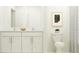 Bright bathroom with a double sink vanity and modern fixtures at 9475 Raised Tulip Ln, Land O Lakes, FL 34637