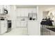 Contemporary kitchen featuring white cabinets, stainless steel appliances, and a center island at 9475 Raised Tulip Ln, Land O Lakes, FL 34637