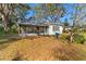 View of a screened in patio showing stone floor and nice yard at 9923 Morris Bridge Rd, Tampa, FL 33637