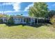 Spacious backyard with a covered patio, perfect for outdoor entertaining and relaxation at 10426 109Th St, Seminole, FL 33778