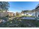Well-sized backyard featuring a covered patio and a mix of grass and garden space at 10426 109Th St, Seminole, FL 33778