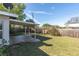 Large backyard with covered patio space and wood fence at 10426 109Th St, Seminole, FL 33778