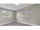 Bedroom featuring neutral colored walls and multiple windows for ample natural lighting at 10426 109Th St, Seminole, FL 33778