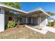 Exterior shot showing decorative posts, lush landscaping and a fresh exterior paint job at 10426 109Th St, Seminole, FL 33778