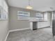 Well-lit kitchen featuring stainless steel appliances and light gray cabinetry at 10426 109Th St, Seminole, FL 33778