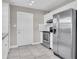 Kitchen featuring white cabinets, stainless steel appliances, and tile floors at 10426 109Th St, Seminole, FL 33778
