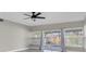 Living area with tile floors, neutral walls, lots of natural light, and a sliding glass door at 10426 109Th St, Seminole, FL 33778