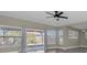 Bright living area with tile floors, neutral walls, natural light, and a sliding glass door at 10426 109Th St, Seminole, FL 33778