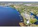 Scenic aerial view of lakeside homes, docks, and green spaces, showing community and recreational opportunities at 1162 Tookes Rd, Tarpon Springs, FL 34689