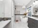 Beautiful bathroom with large tub, shower, and grey accents. The bathroom features marble countertops and floors at 1162 Tookes Rd, Tarpon Springs, FL 34689