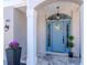 Close-up of the home's stylish blue front door with decorative details at 1162 Tookes Rd, Tarpon Springs, FL 34689