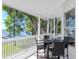Covered porch with lake views and outdoor seating at 1162 Tookes Rd, Tarpon Springs, FL 34689