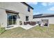Backyard patio area with outdoor seating, a grill, and a playset, perfect for outdoor entertainment at 11828 Miracle Mile Dr, Riverview, FL 33578