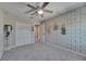 Bedroom featuring a ceiling fan, carpeted floor, painted accent wall and closet with double doors at 11828 Miracle Mile Dr, Riverview, FL 33578